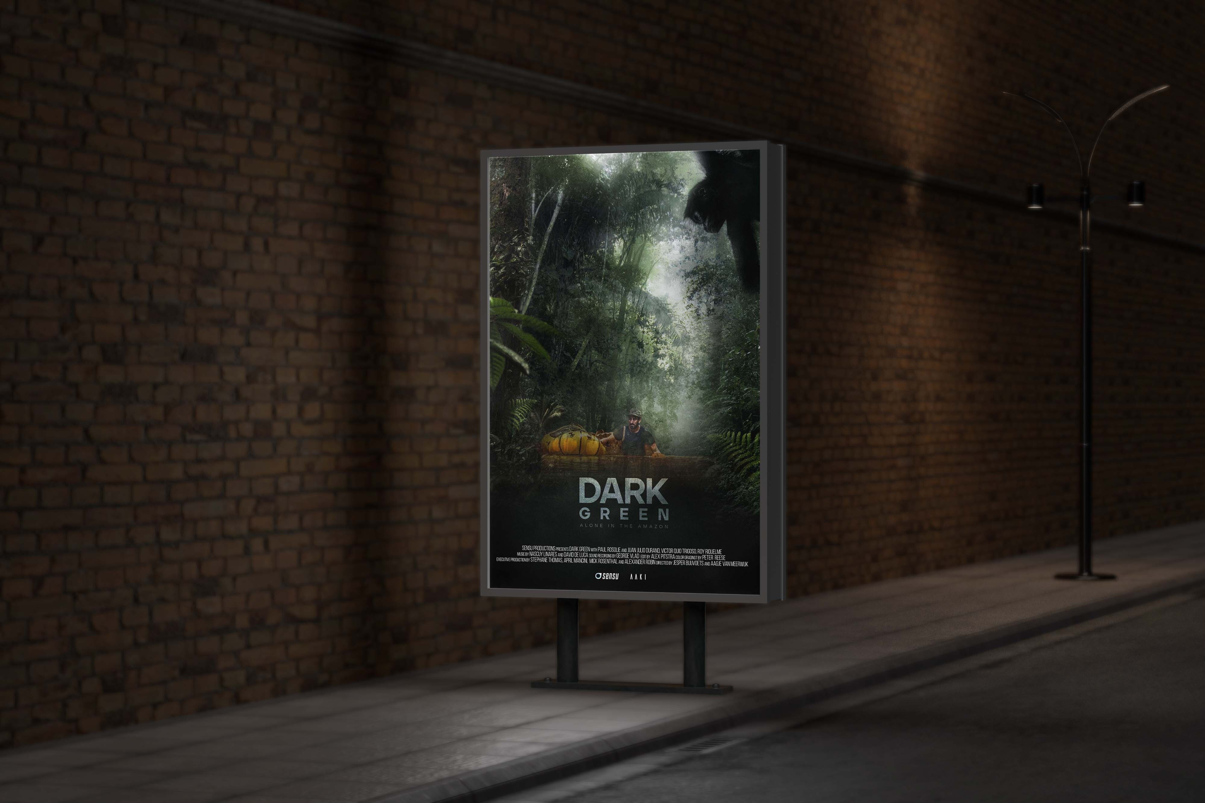 A film poster of Dark Green displayed on a billboard