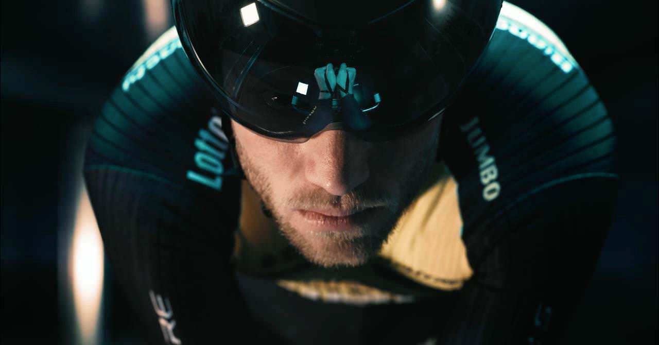 Image of a professional cyclist spinning inside a wind tunnel to practice