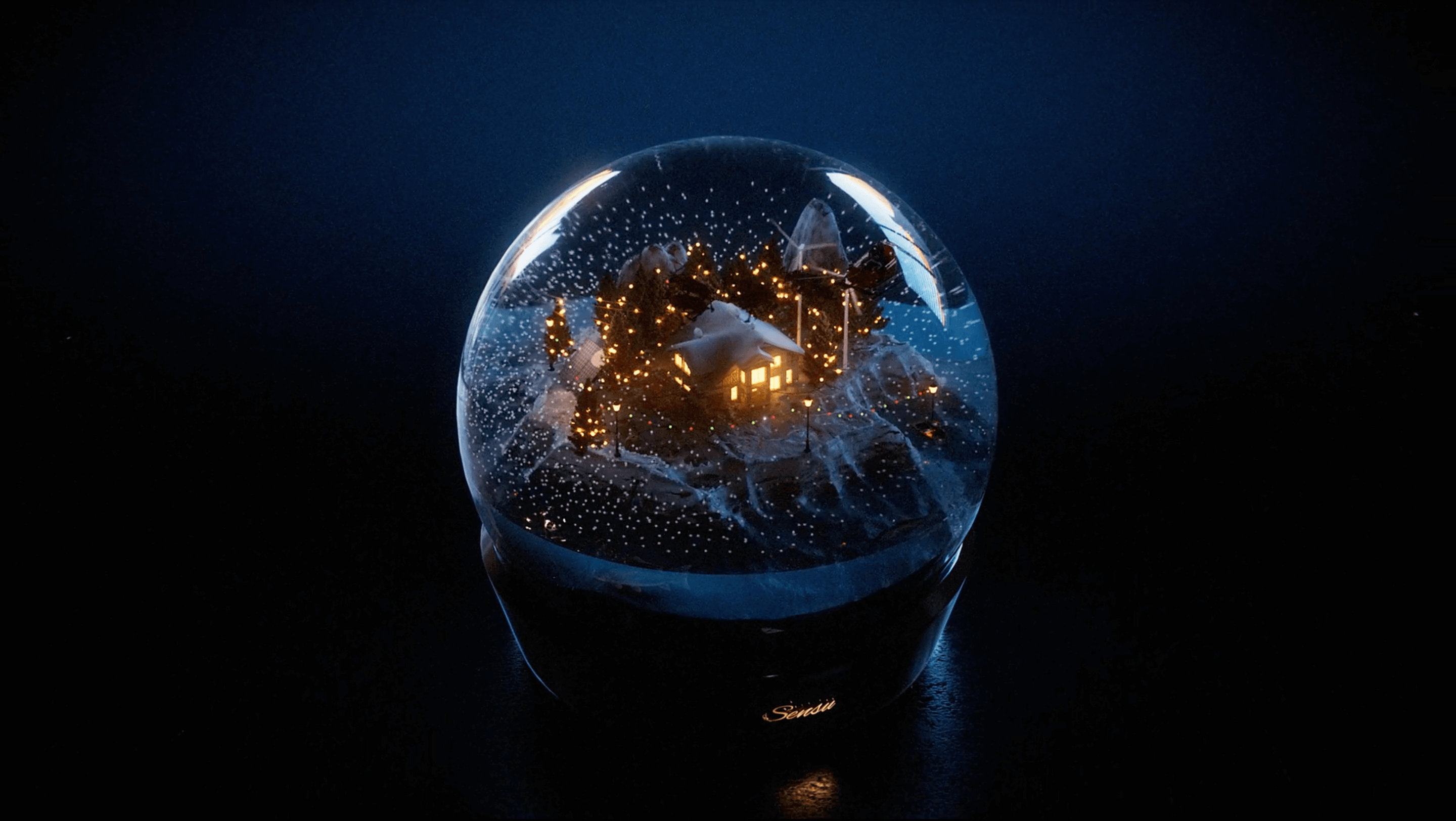 3D animation of a snowglobe with a christmas town.png